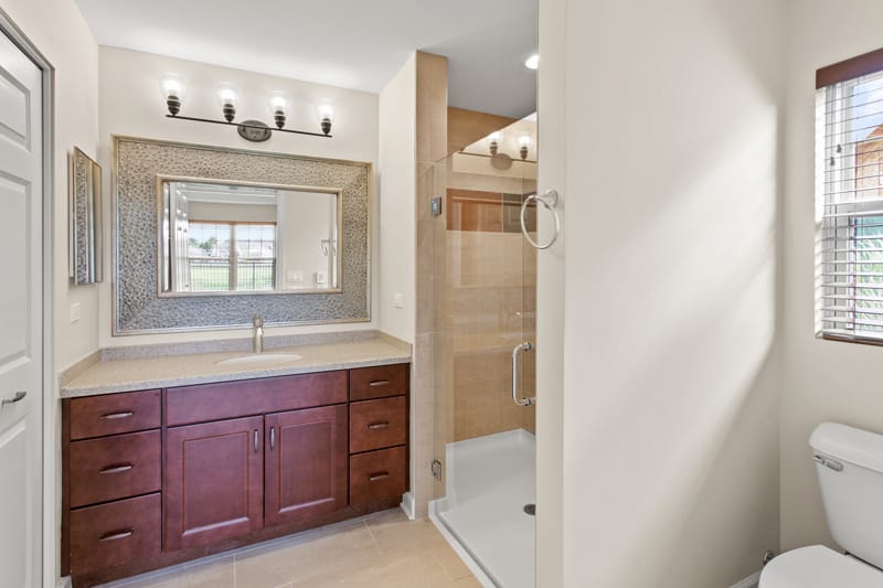 Modern bathroom with a walk-in shower and large mirror