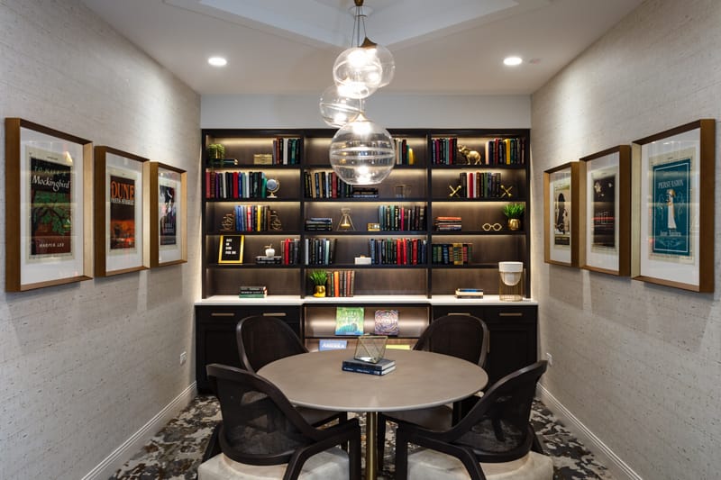 Inviting common area with bookshelves and a round table