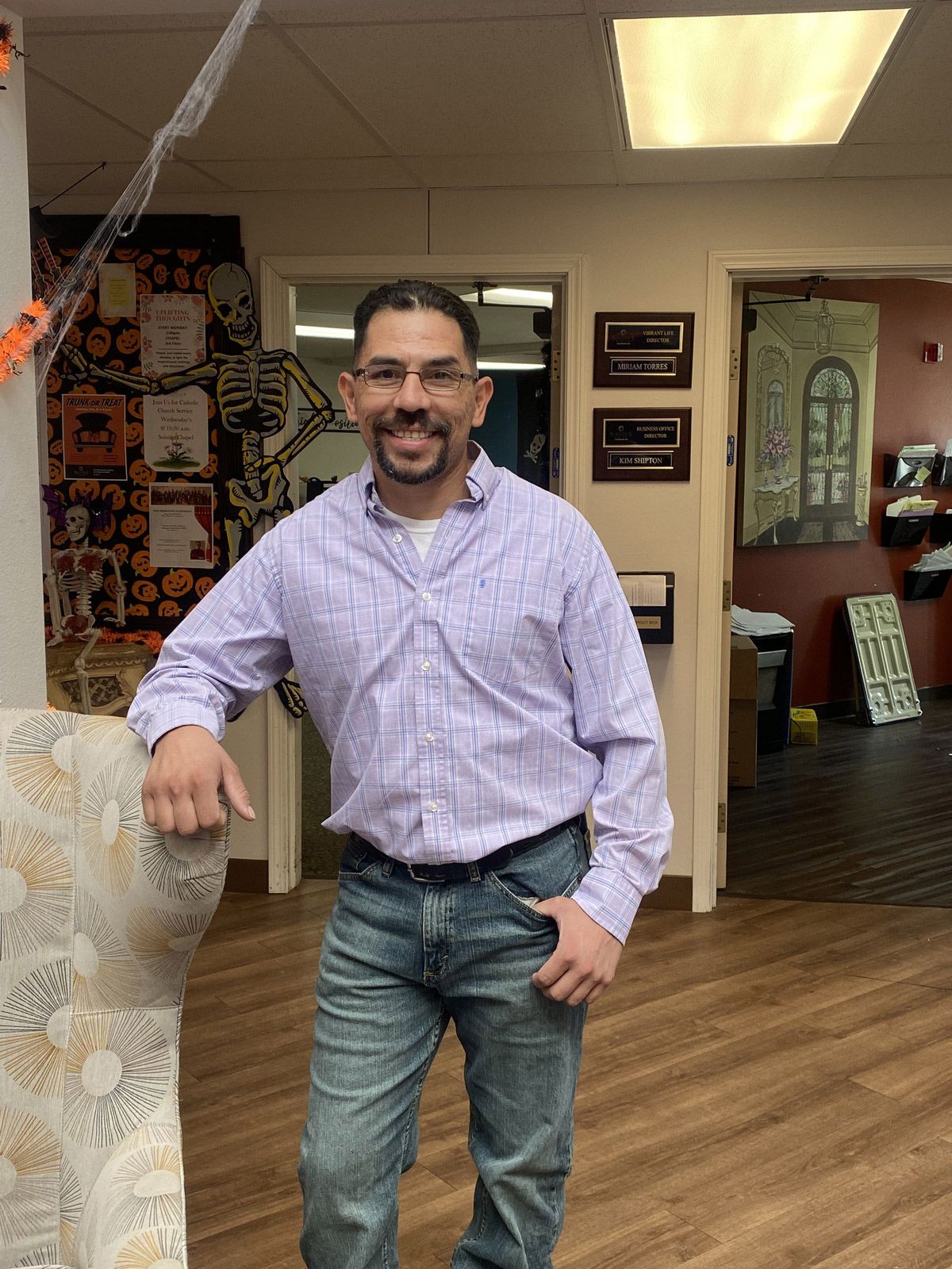 Staff member posing in the facility's interior