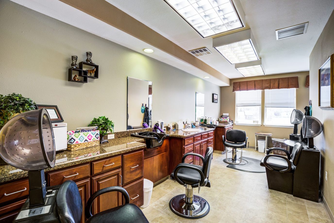 Hair salon area with styling stations and equipment.