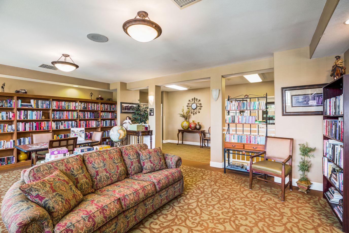 Interior common area with bookshelves and seating