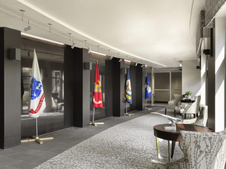 Interior corridor with flags and seating area