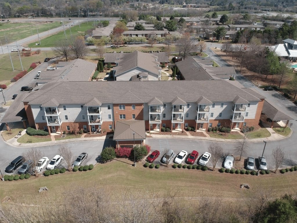 Aerial view of Country Cottage Huntsville showcasing the building and surrounding landscape.
