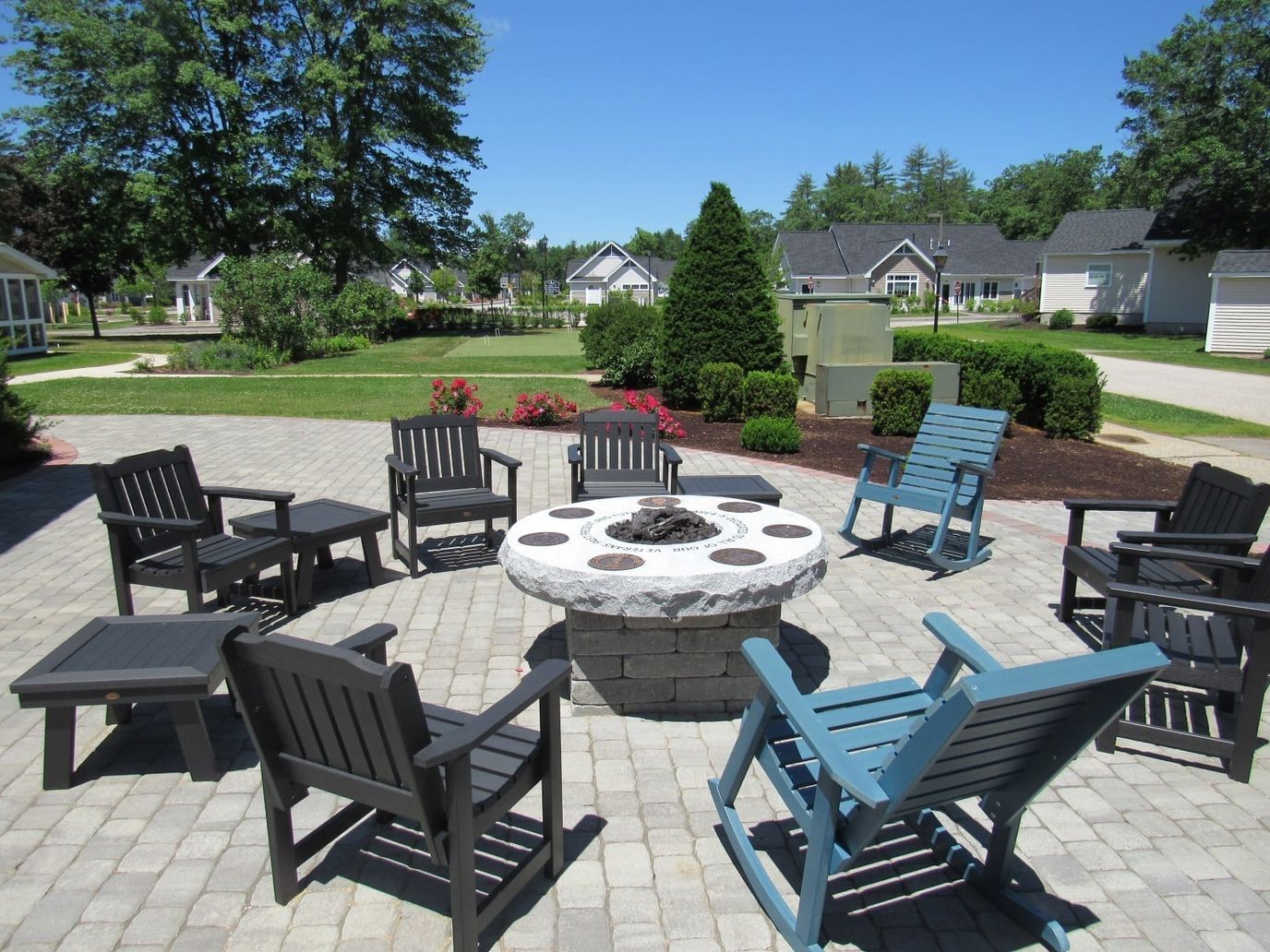Outdoor firepit area surrounded by seating at Heritage Heights