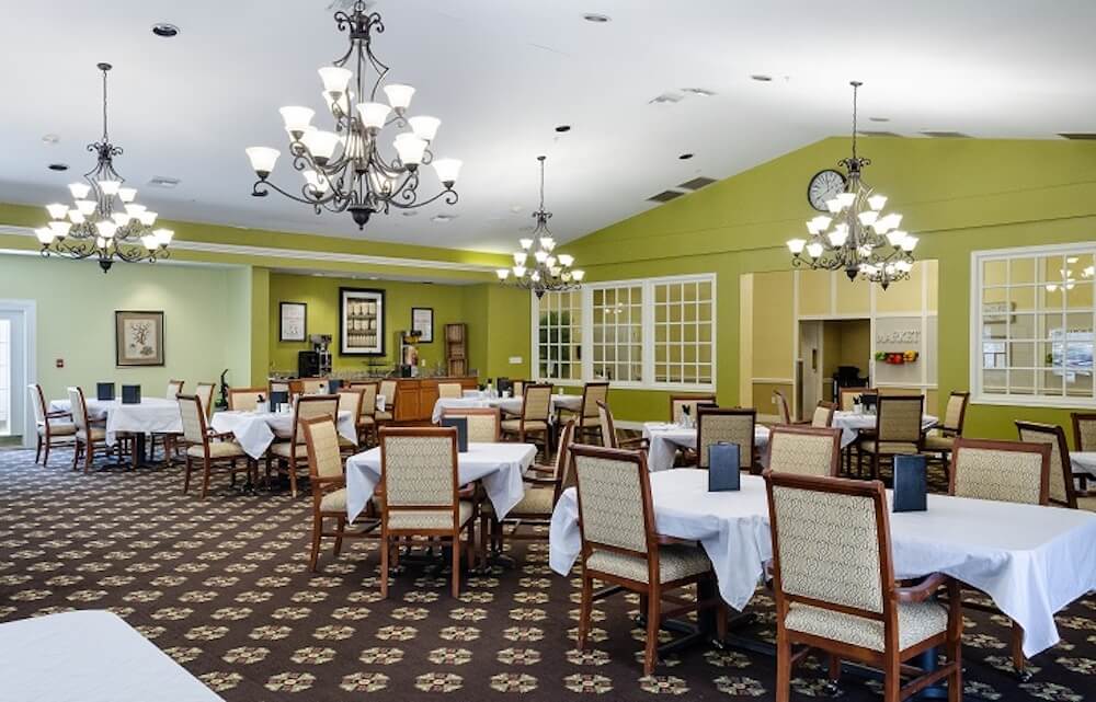 Spacious dining room with tables set for meals