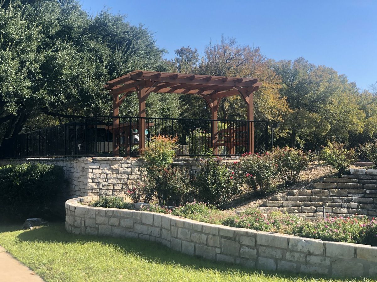 Outdoor pergola in a landscaped garden area