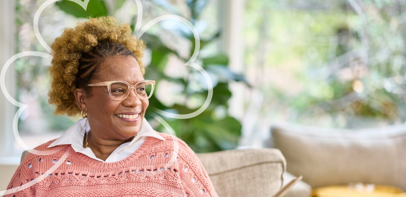 Smiling resident in a cozy interior lounge
