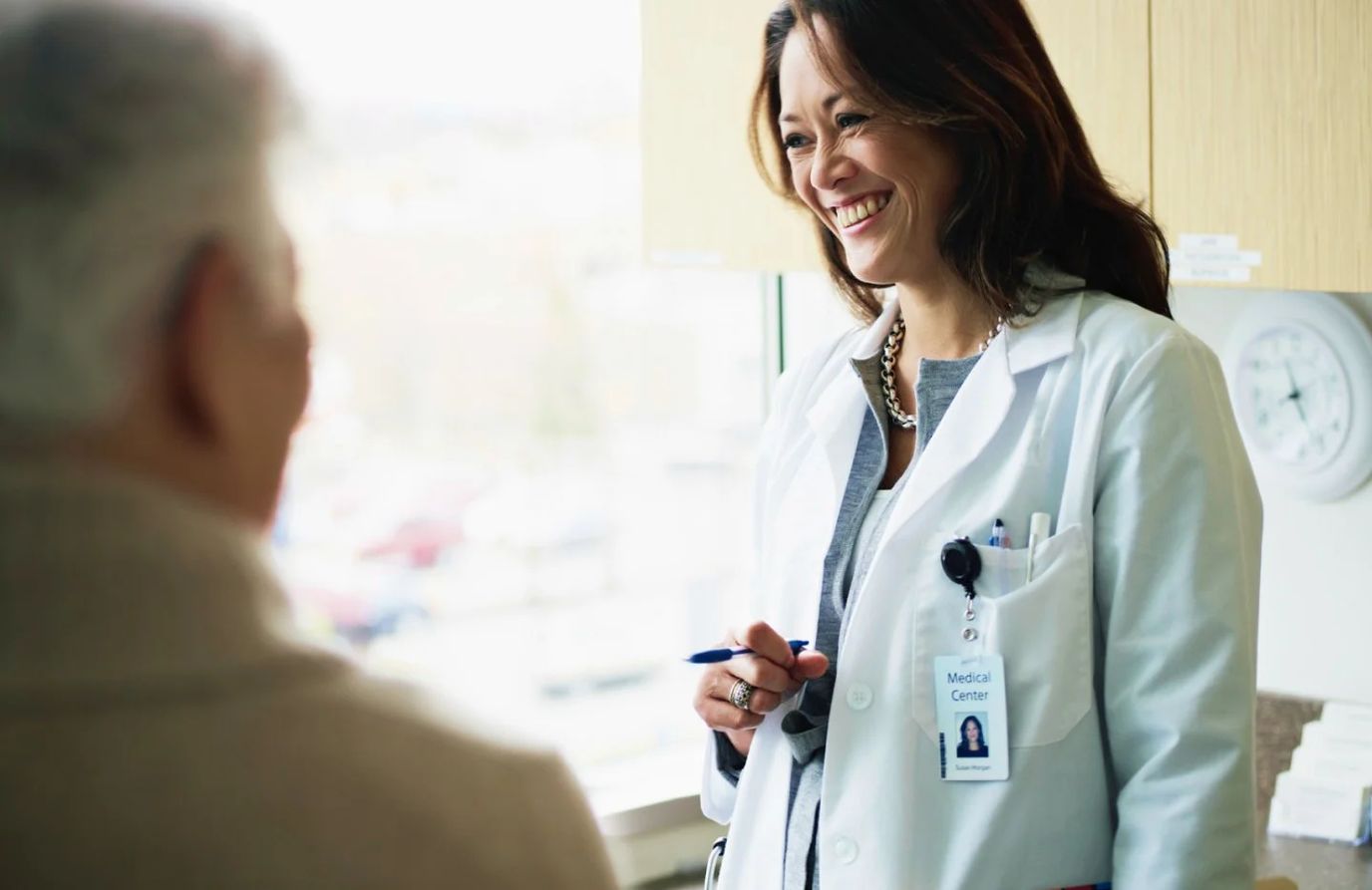 Doctor smiling and interacting with a resident
