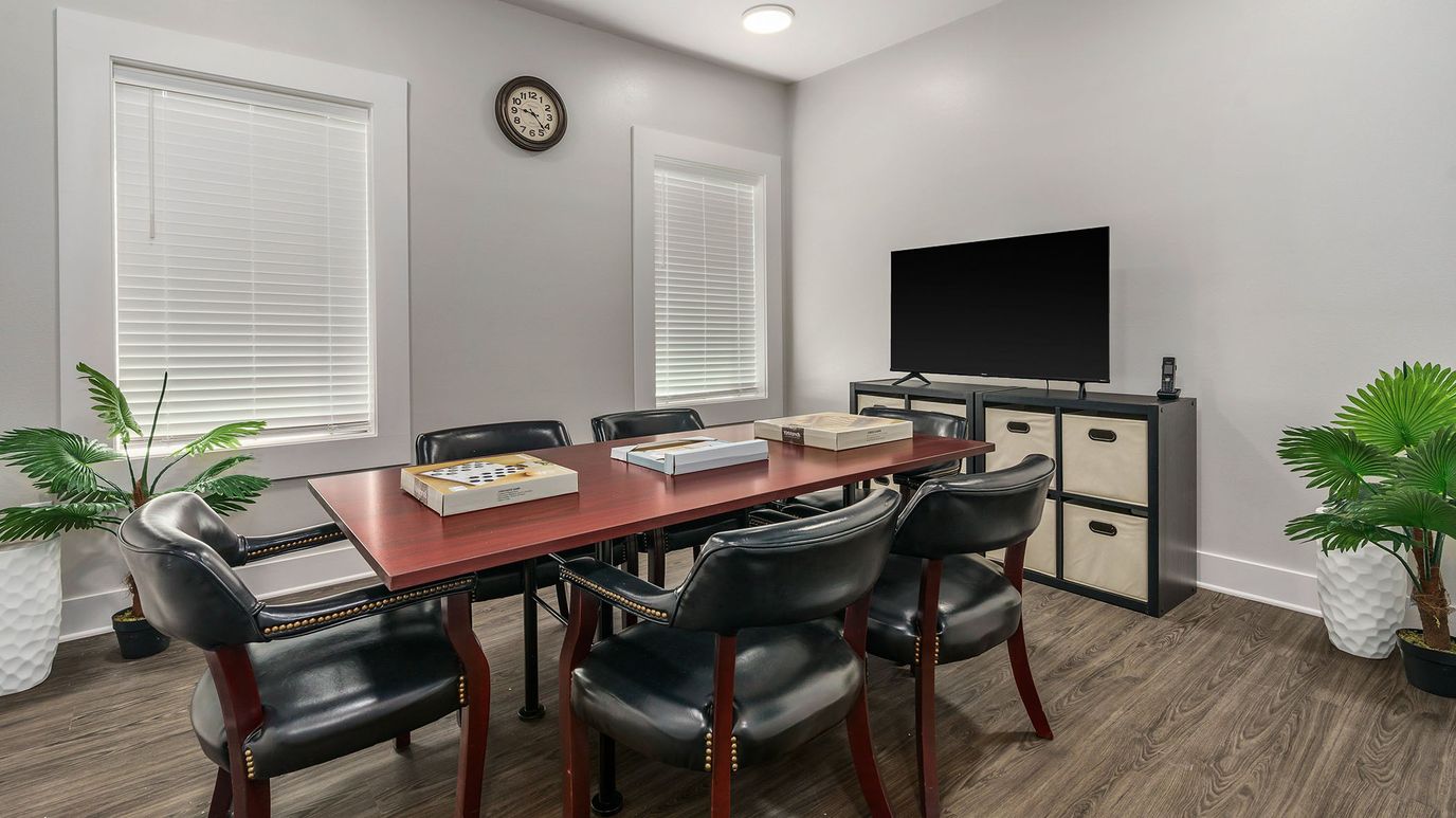 Interior meeting room with a table and chairs