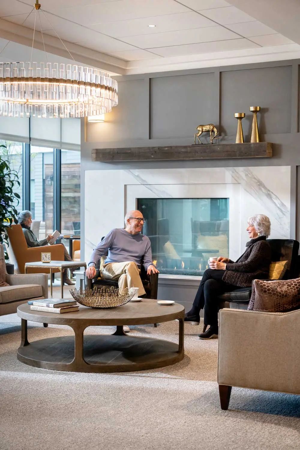 Residents enjoying conversation in a cozy common area