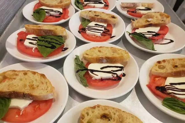 Serving of caprese salad with basil and balsamic glaze