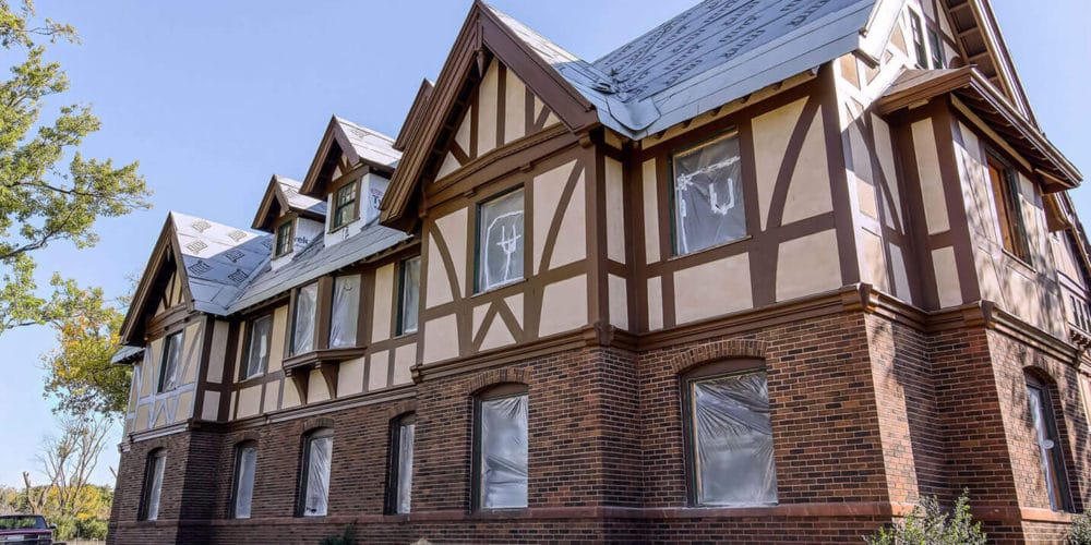 Exterior view of a residential building under construction.