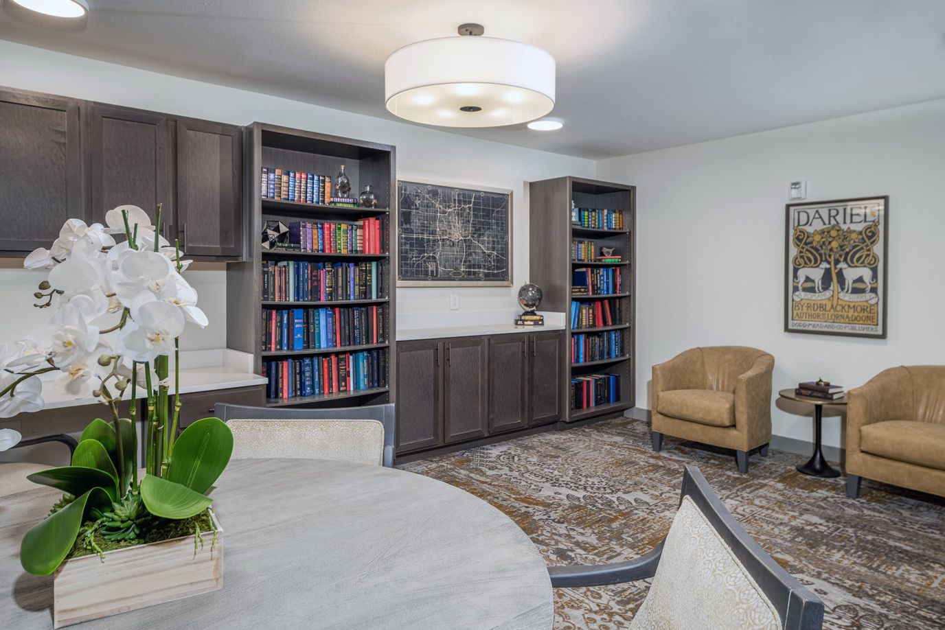 Comfortable common area with bookshelves and seating
