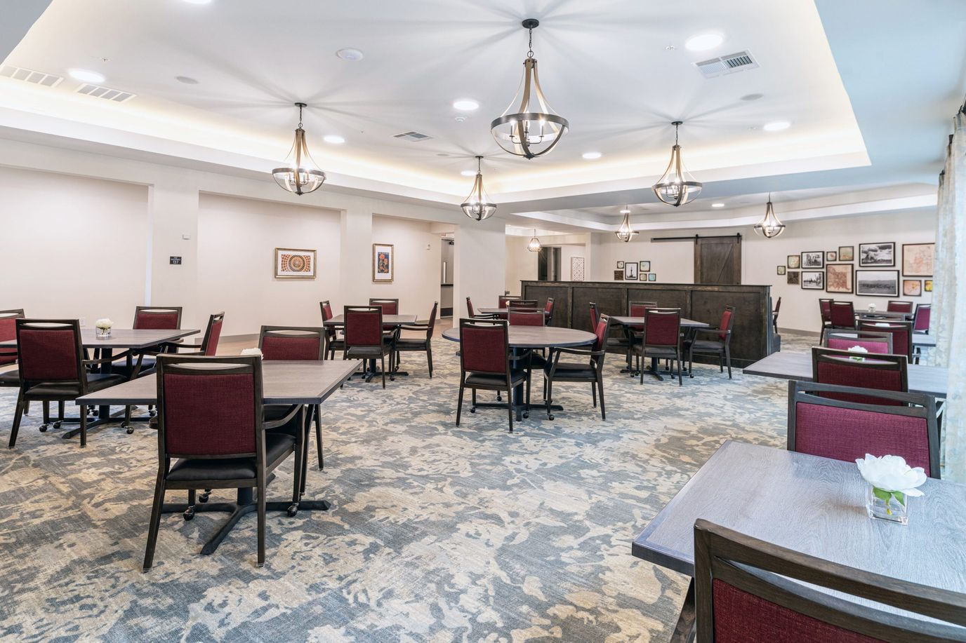Dining area with tables and chairs for residents.