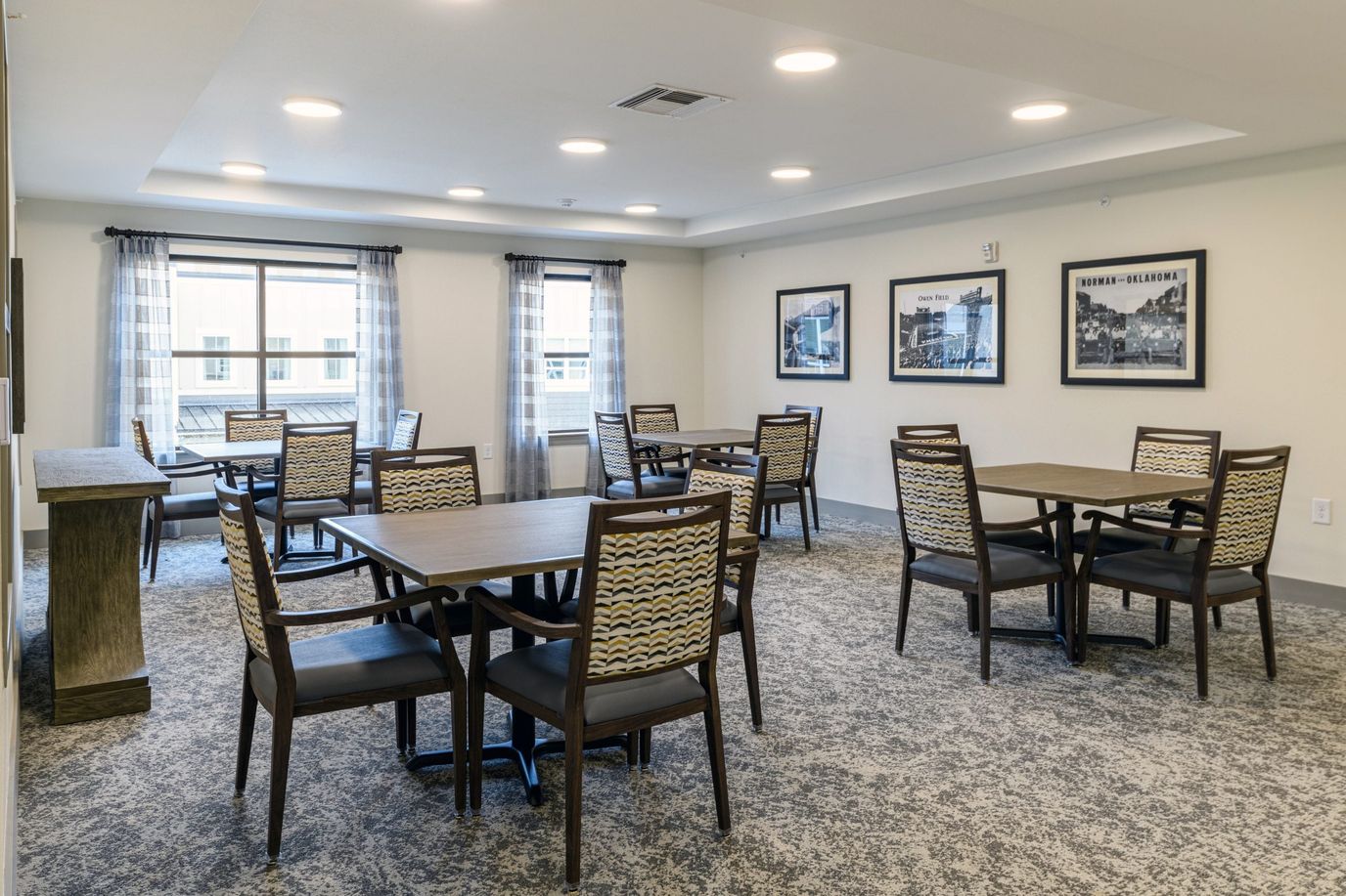 Dining area with tables and chairs.