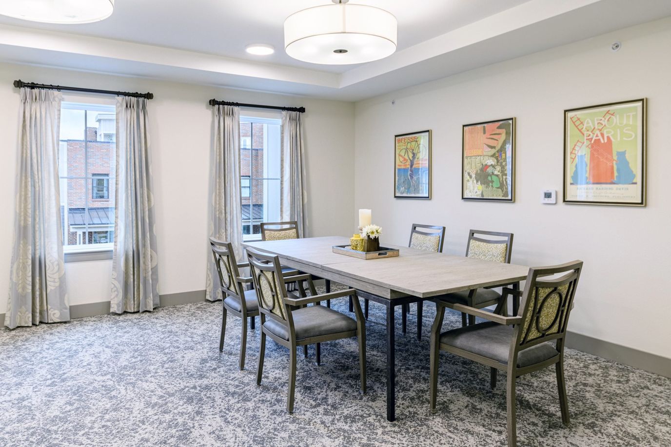 Bright and inviting common area with a dining table.