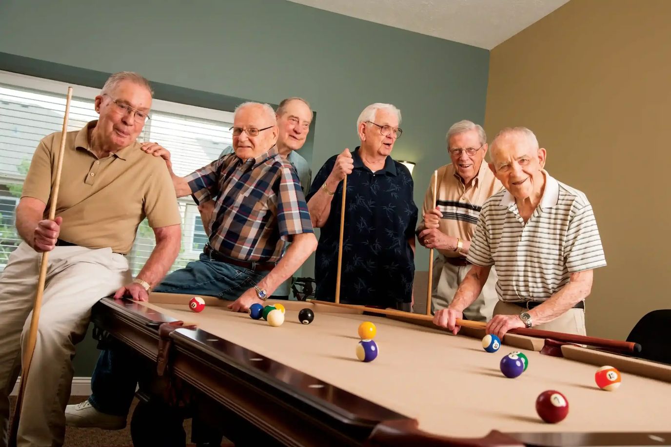 Residents enjoying a game of billiards together