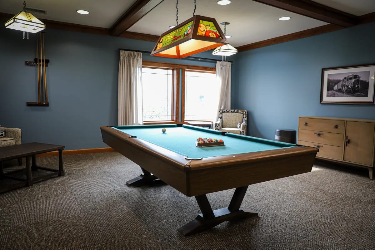 Interior view of a recreational room with a pool table