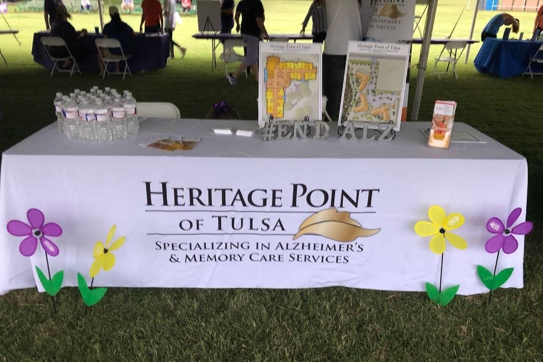 Event table with marketing materials and flowers