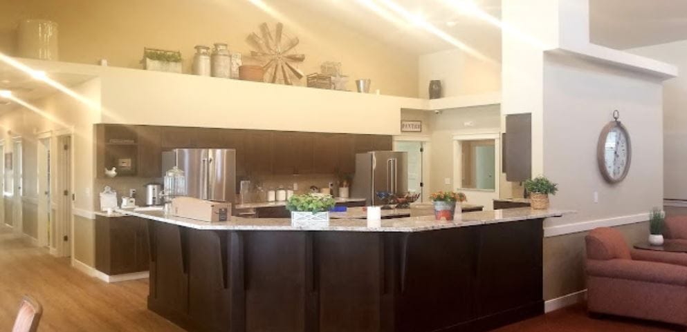 Common kitchen area with granite countertops and modern appliances.