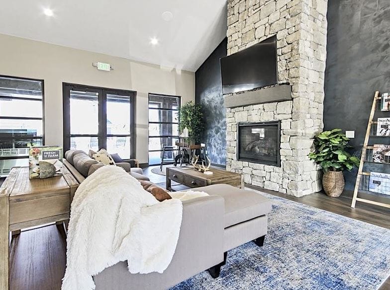 Spacious living room with stone fireplace and modern decor