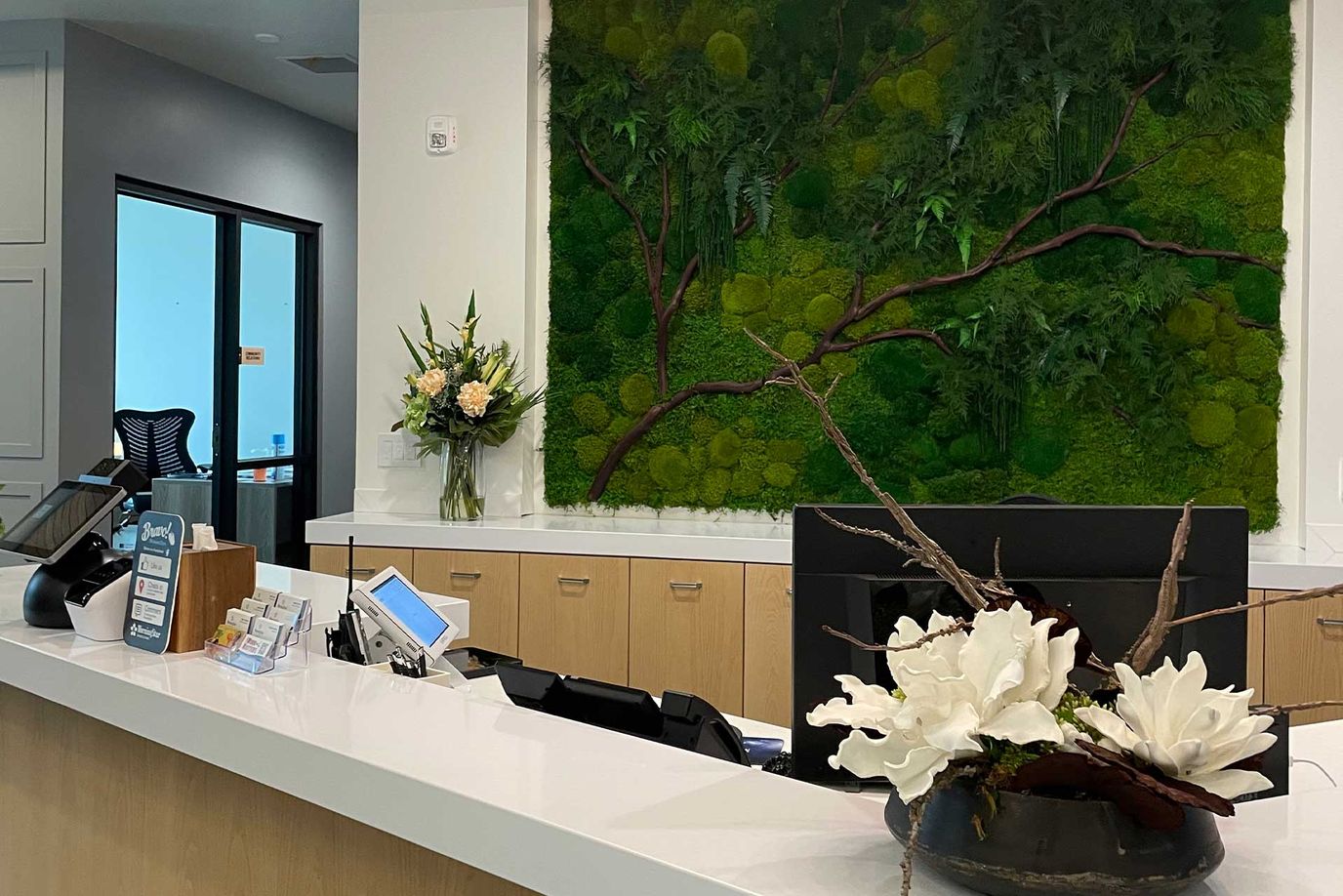 Interior reception area with decorative greenery