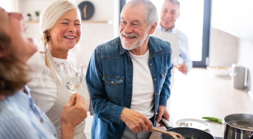 Residents cooking together in a shared kitchen