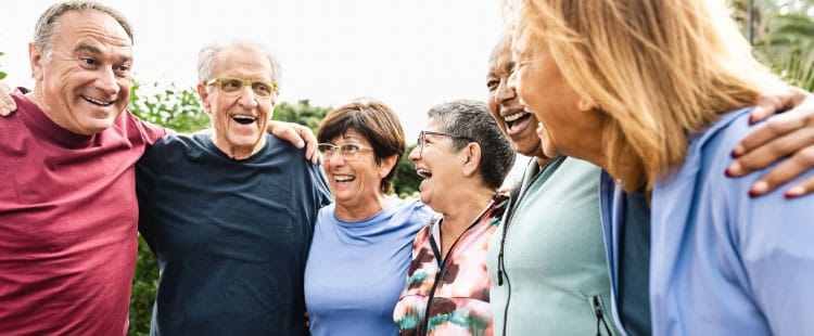 Residents and staff enjoying a joyful moment outdoors