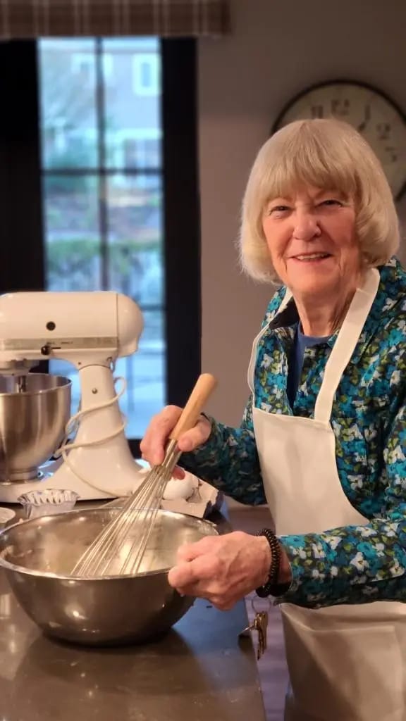 Resident cooking in a kitchen setting