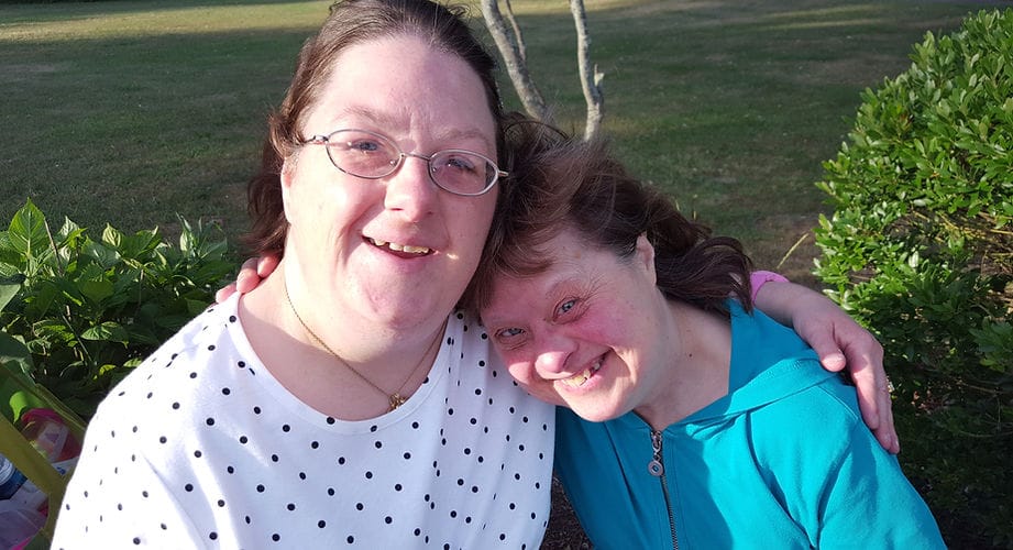 Two women smiling together outdoors
