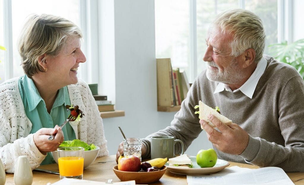 Two seniors enjoying a meal together