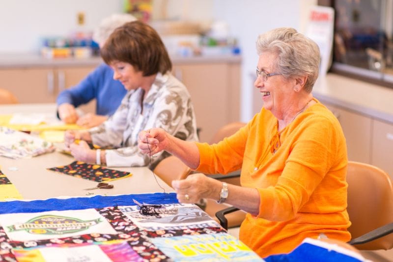 Residents engaging in a crafting activity together.