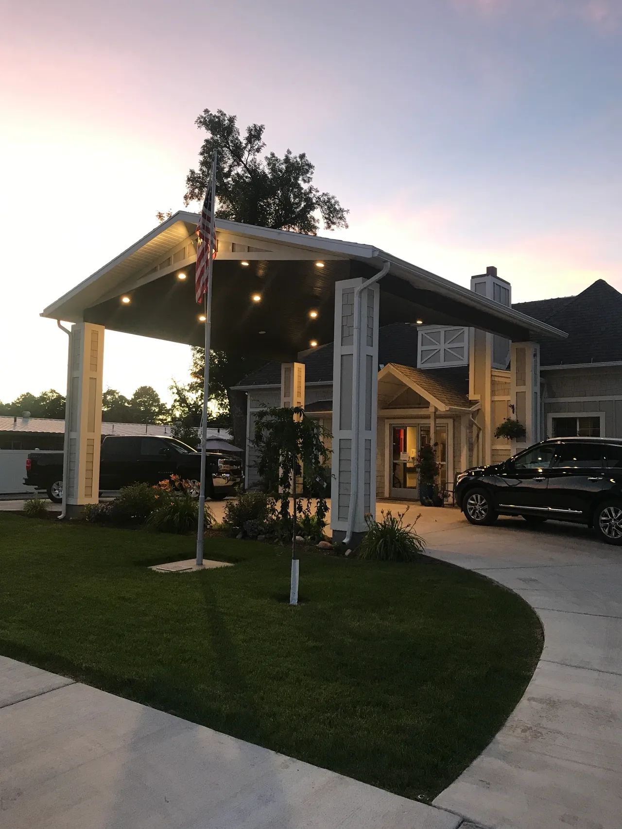 Entrance of Heritage Gardens of Springville with American flag