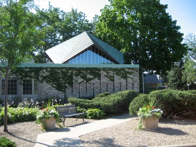 View of the Heritage of Edina building with garden area