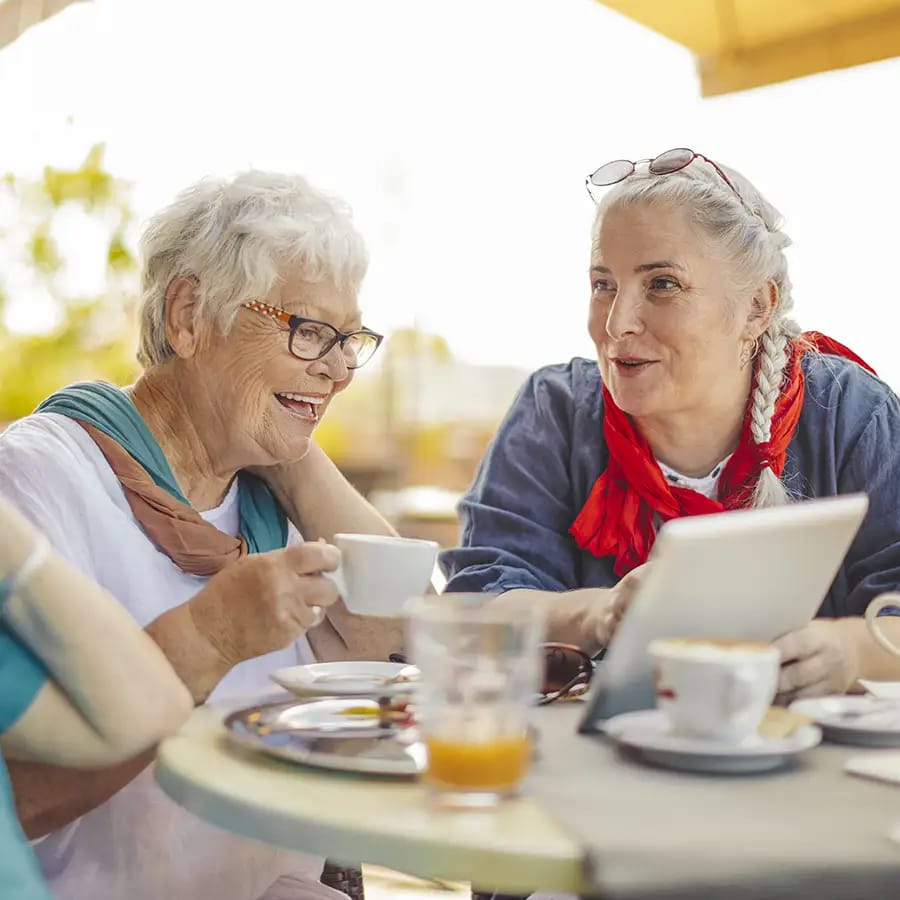 Two residents enjoying coffee outdoors together
