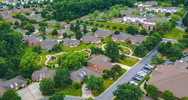 Aerial view of a senior living campus with gardens