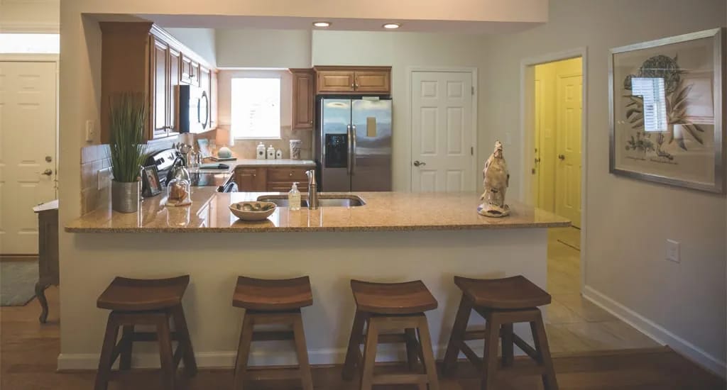 Bright kitchen space with granite countertops
