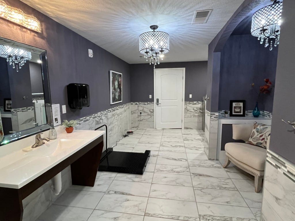 Spacious and stylish bathroom with modern lighting and decor.