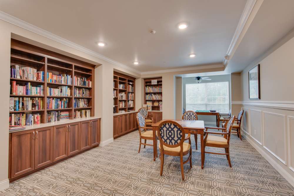 Cozy library area with bookshelves and seating