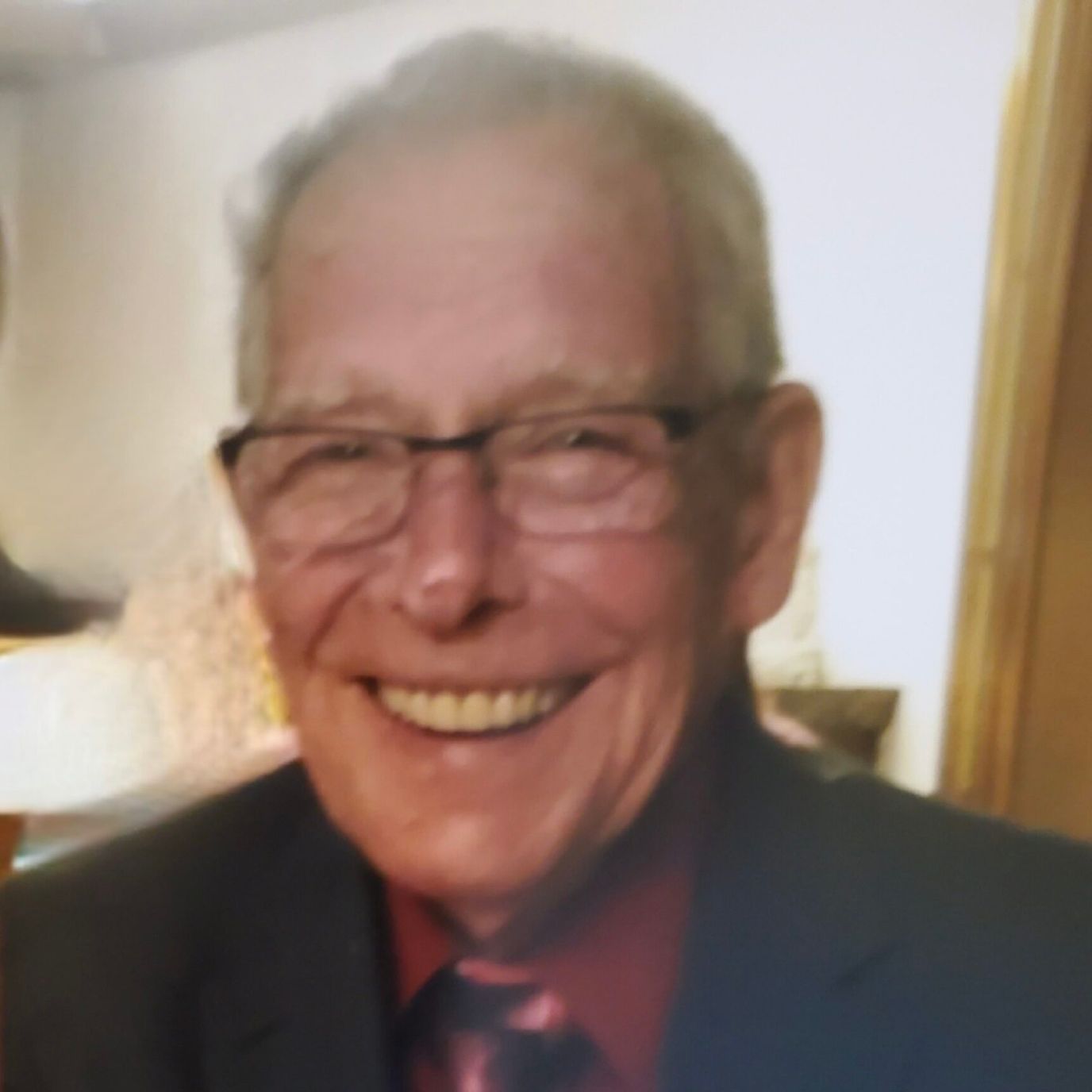 Smiling elderly man in a suit