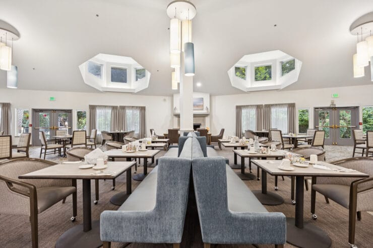 Bright dining room with tables and chairs.