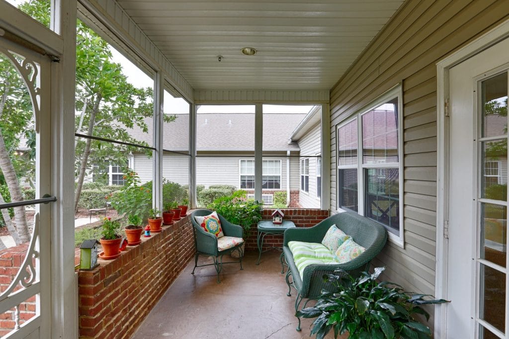 Porch with seating and potted plants