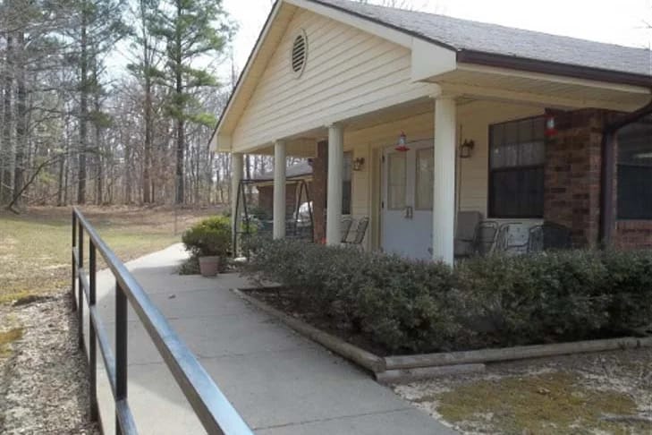 Front entrance of a senior living facility with a pathway