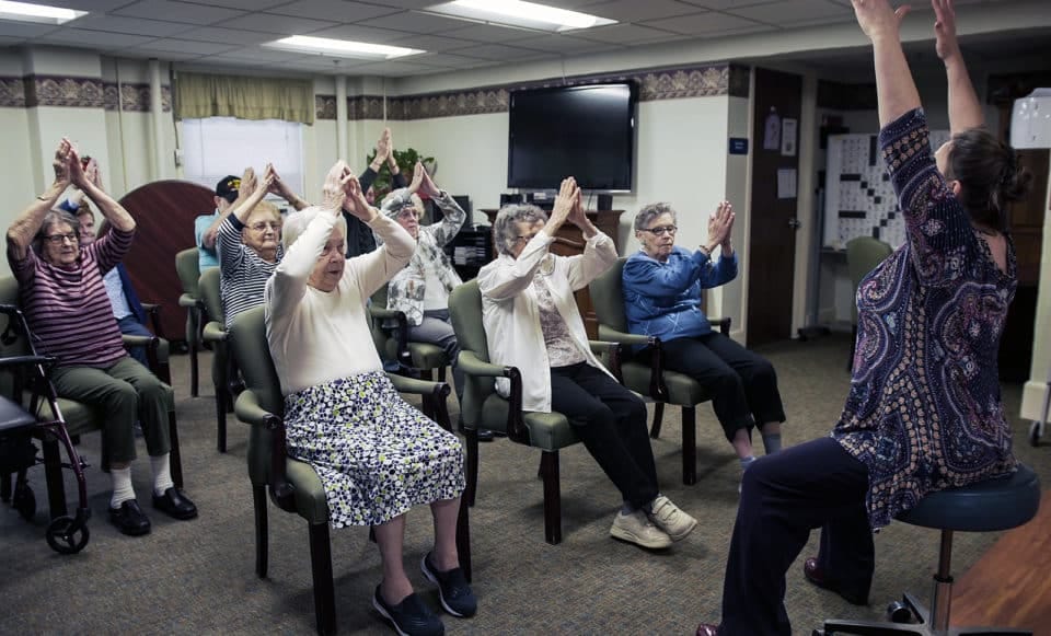 Residents participating in a group activity in a common area