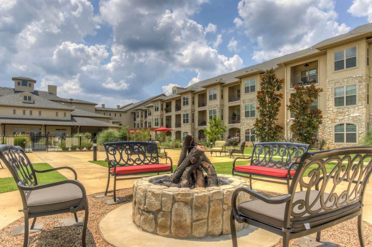 Outdoor courtyard with fire pit and seating