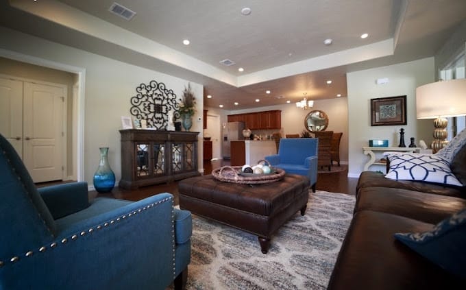 Cozy living room with seating and decorative accents.