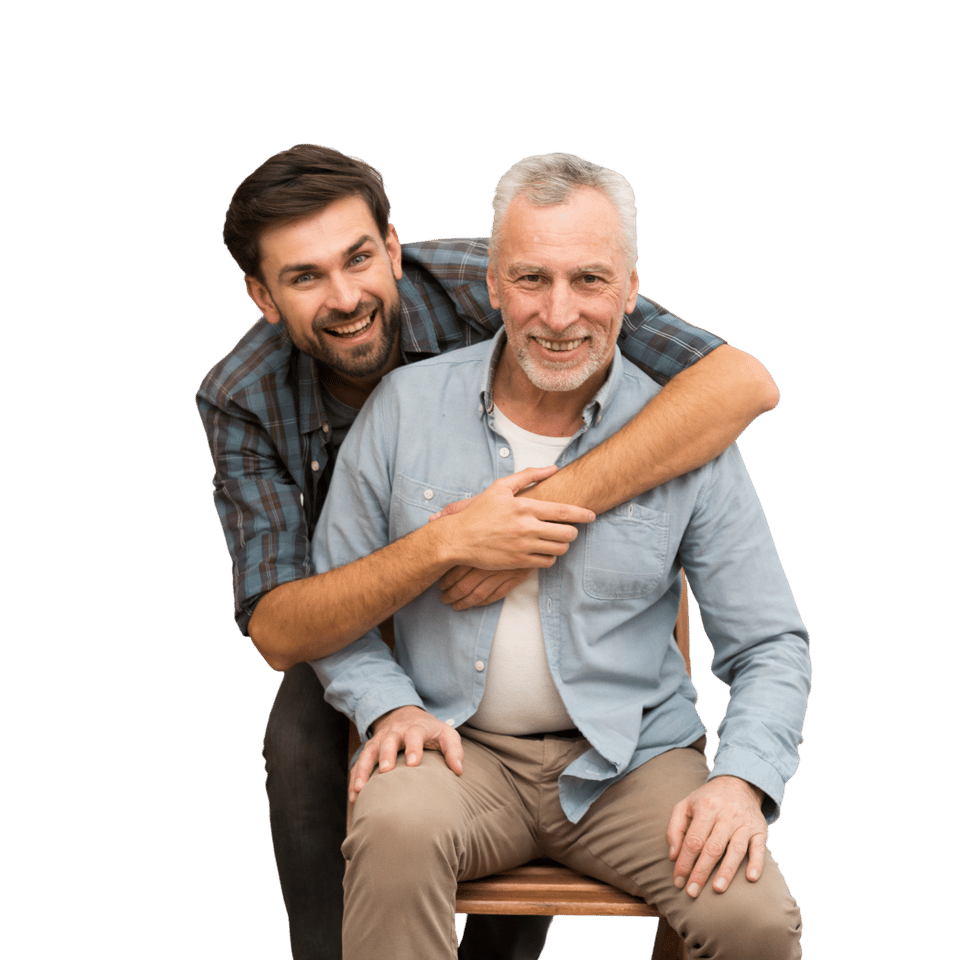Two men smiling, one embracing the other.