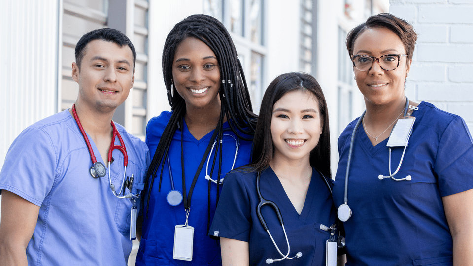 Healthcare staff smiling outdoors