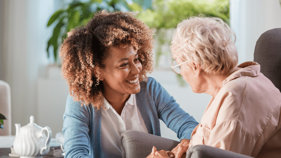 Caregiver interacting with an elderly resident