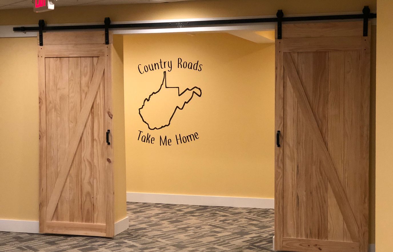 Interior hallway with wooden sliding doors and artwork
